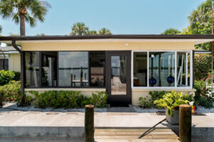 A photo of impact-resistant windows installed in a modern Florida home, showcasing the sturdy glass and frame.